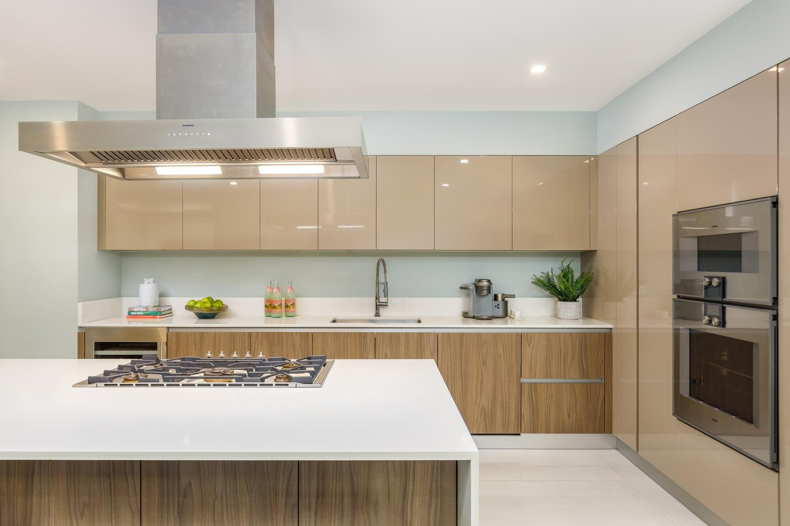 Modern kitchen with a central island and warm wood cabinetry